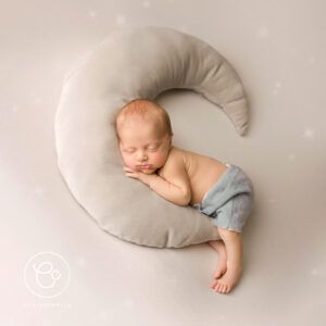 Photoshoot of a Newborn Baby On A Moon Cushion