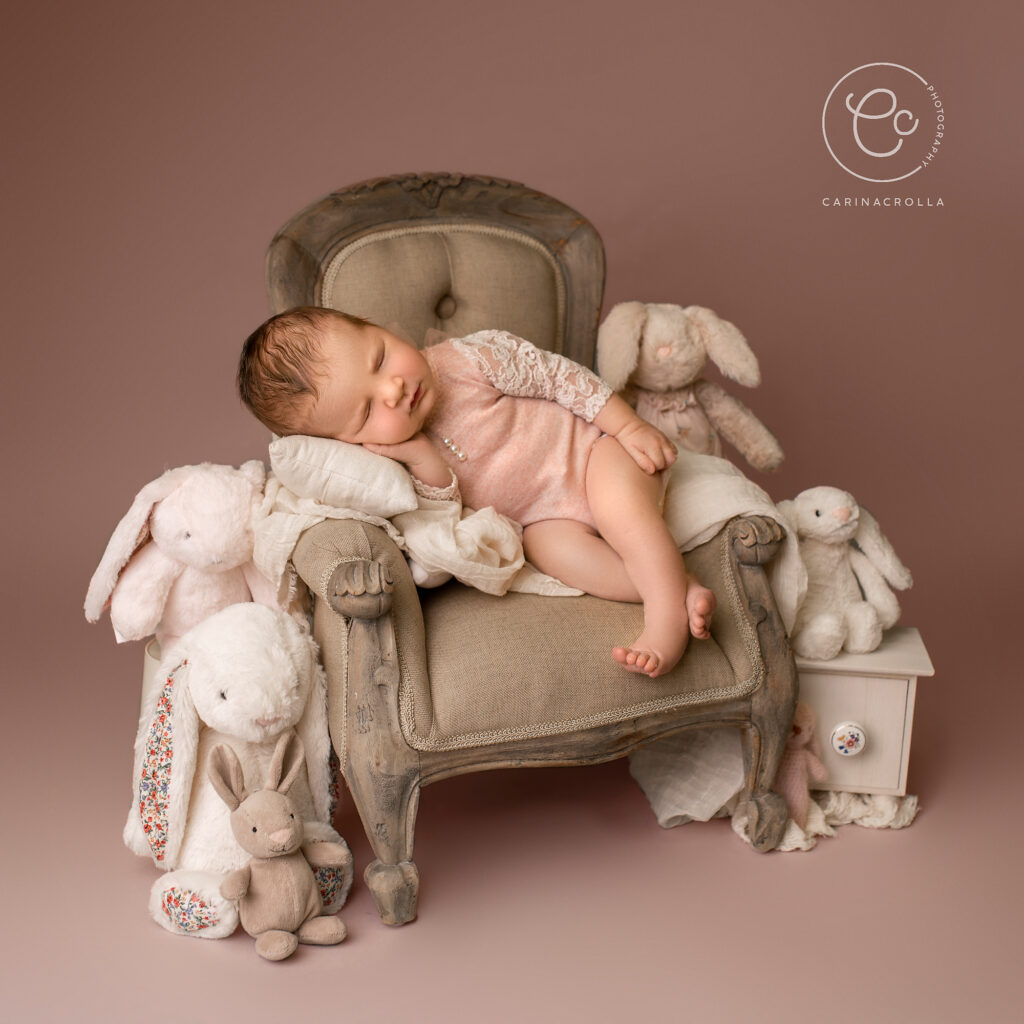 Newborn baby sleeping in a chair - Best Time For Newborn Photos